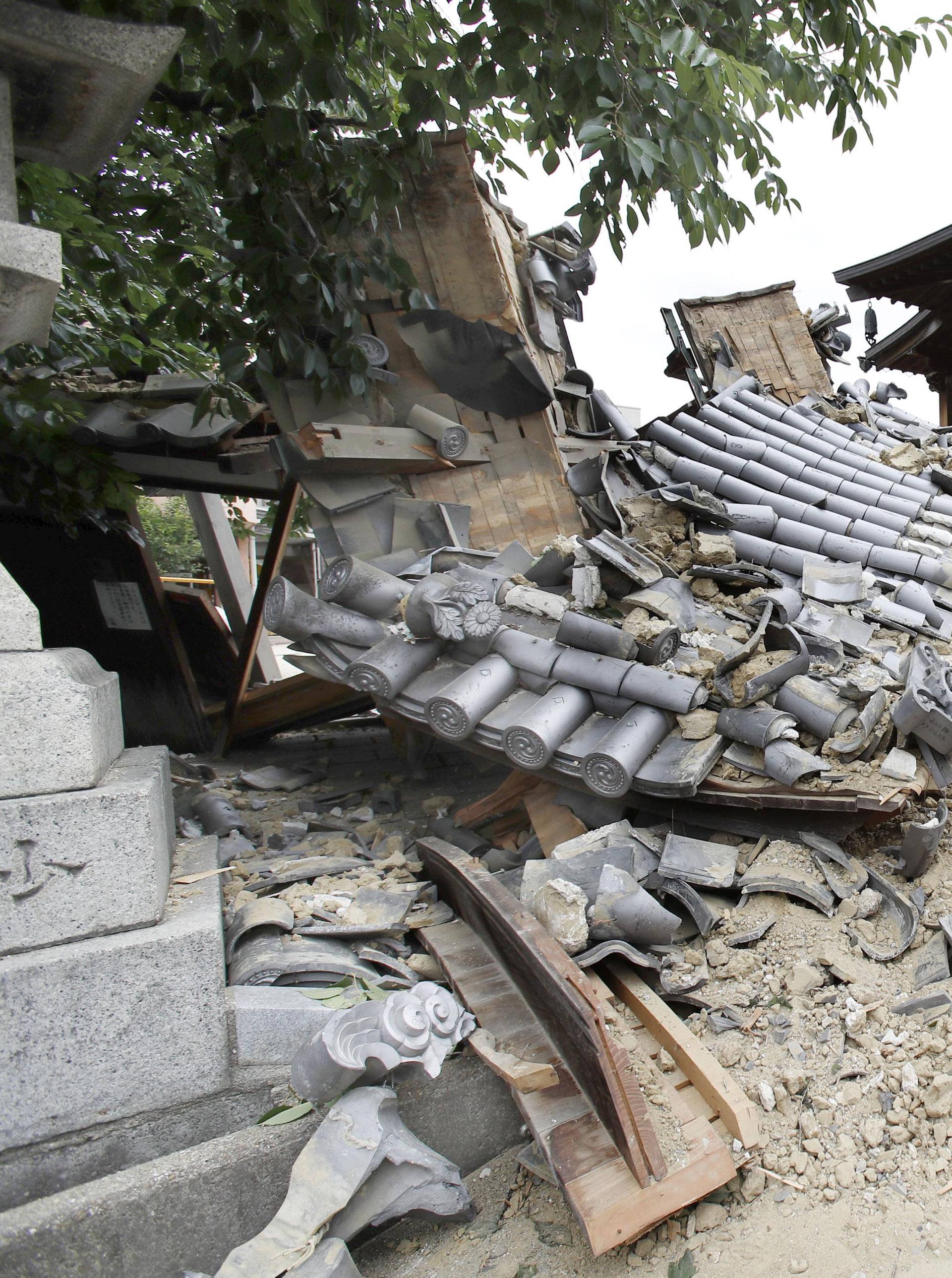 Damaged Myotoku-ji temple caused by an earthquake is seen in Ibaraki, Japan