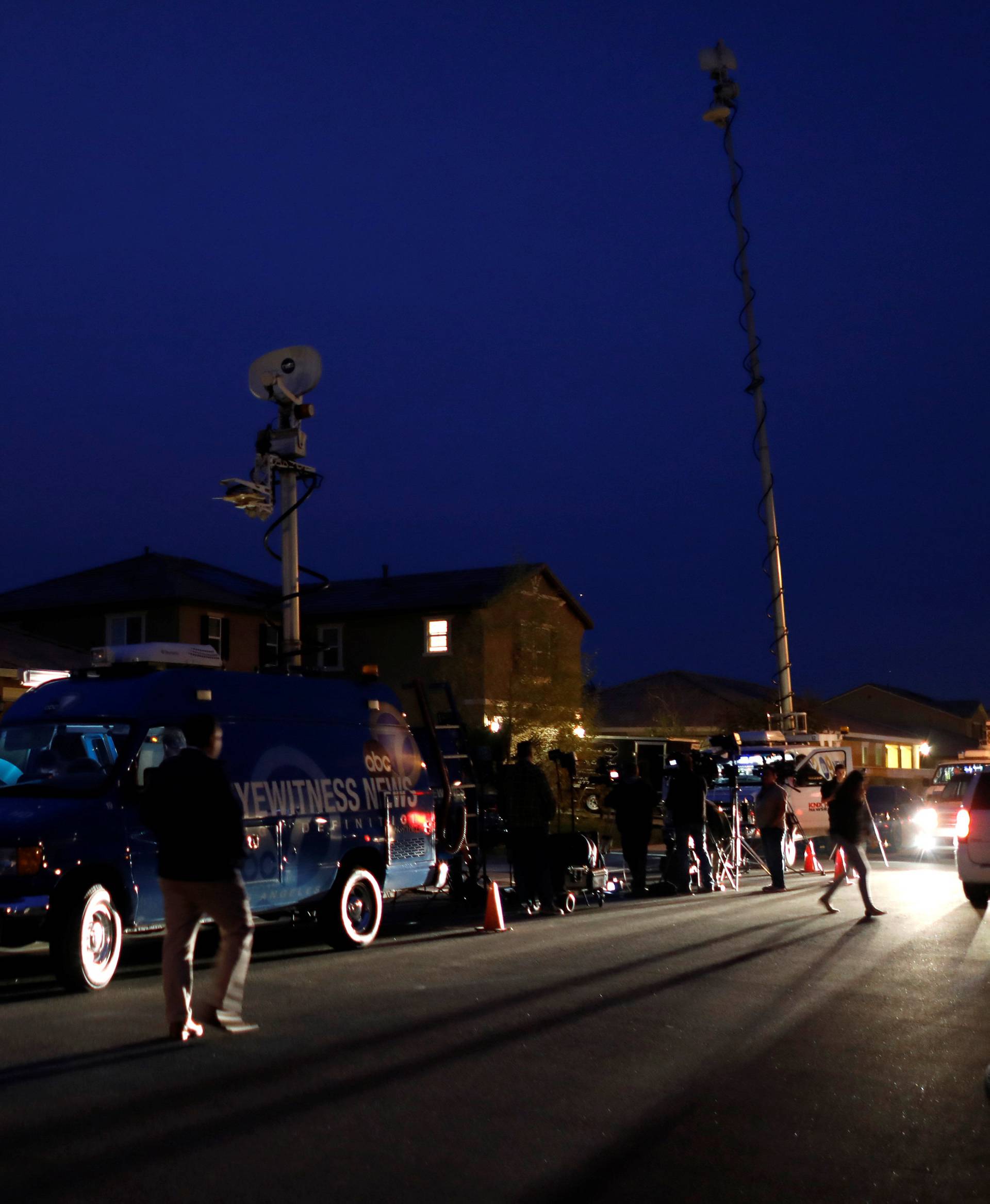 News crews gather outside the home of David Allen and Louise Anna Turpin in Perris, California