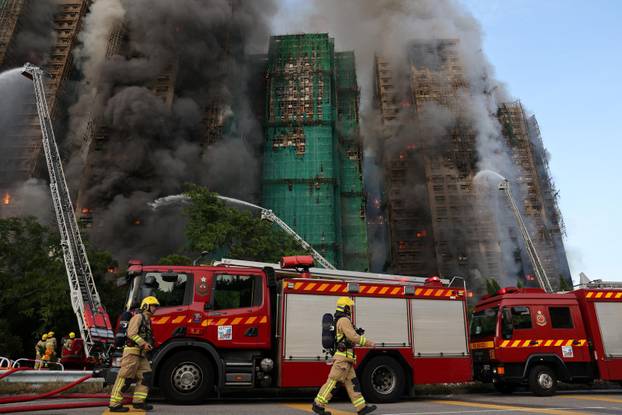 Flames engulf bamboo scaffolding across multiple buildings at Wang Fuk Court housing estate, in Tai Po