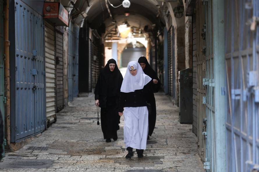 Cancellation of the traditional Palm Sunday procession from the Mount of Olives to Jerusalem, amid restrictions on gathering in large groups and the U.S.-Israel conflict with Iran