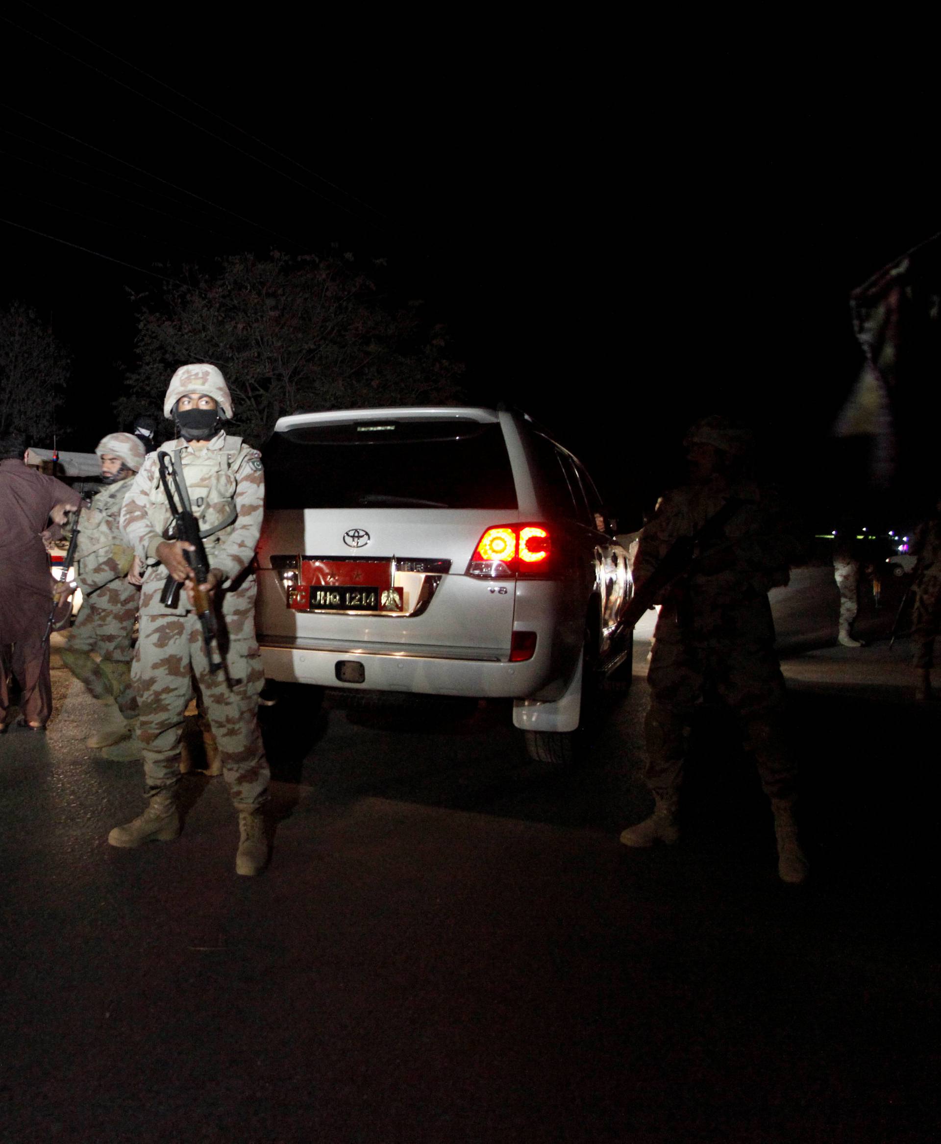 A Pakistani soldier stands guard outside the Police Training Center after an attack on the center in Quetta