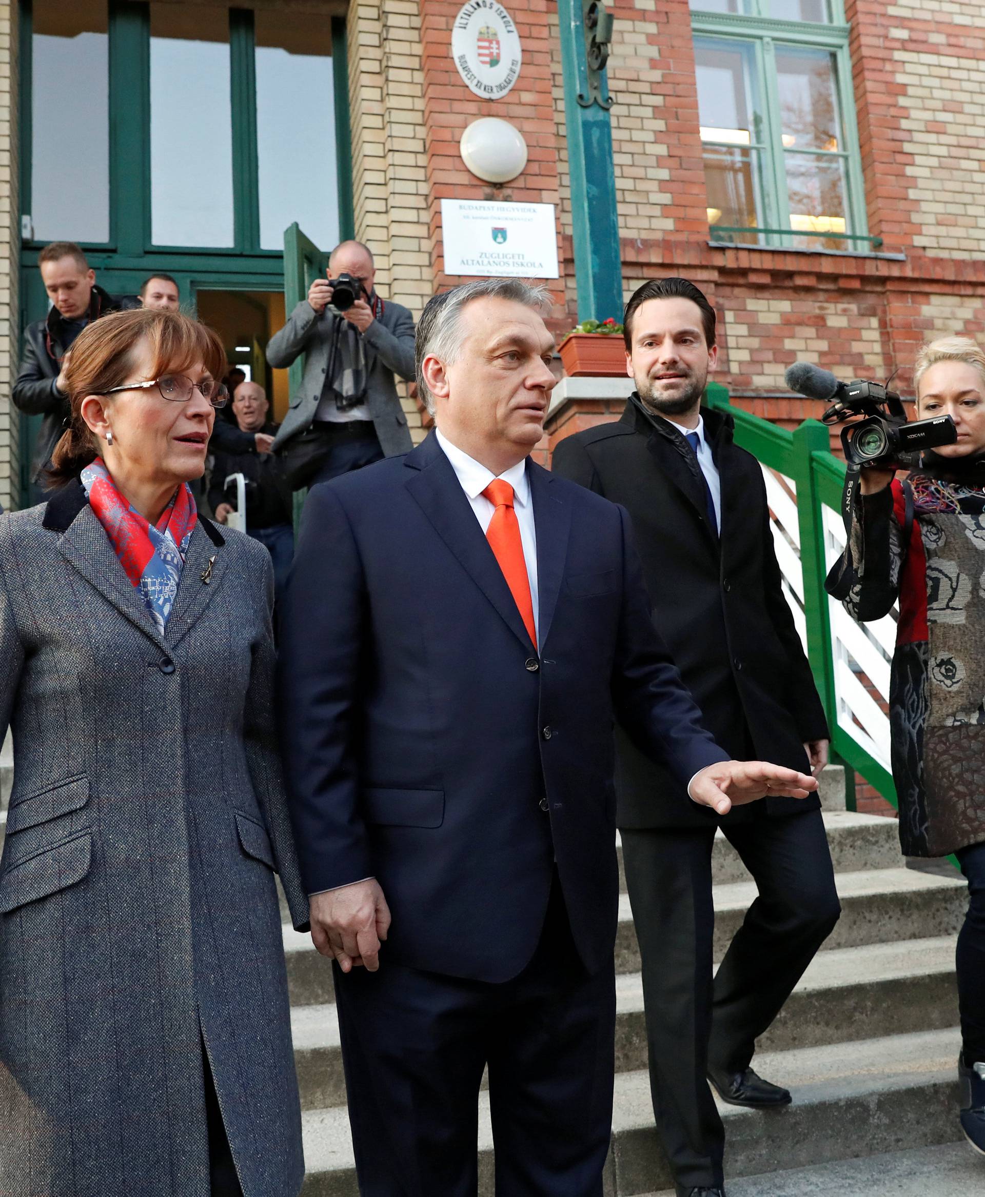 Current Hungarian Prime Minister Viktor Orban and his wife Aniko Levai leave a polling station during Hungarian parliamentary election in Budapest