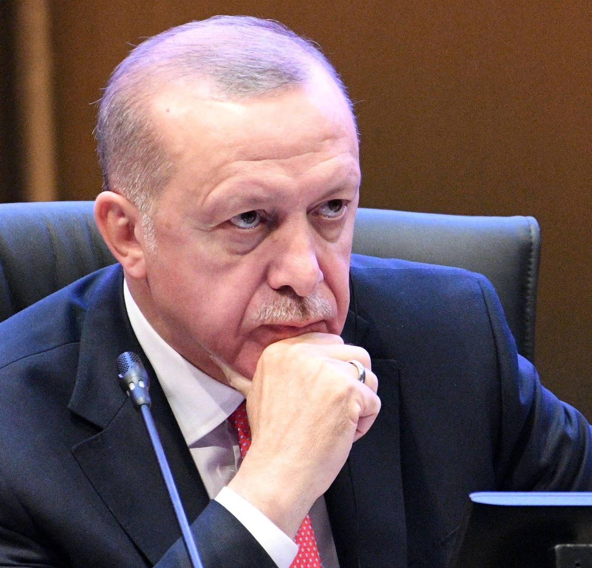 Turkey's President Recep Tayyip Erdogan reacts during a Kuala Lumpur Summit roundtable session in Kuala Lumpur