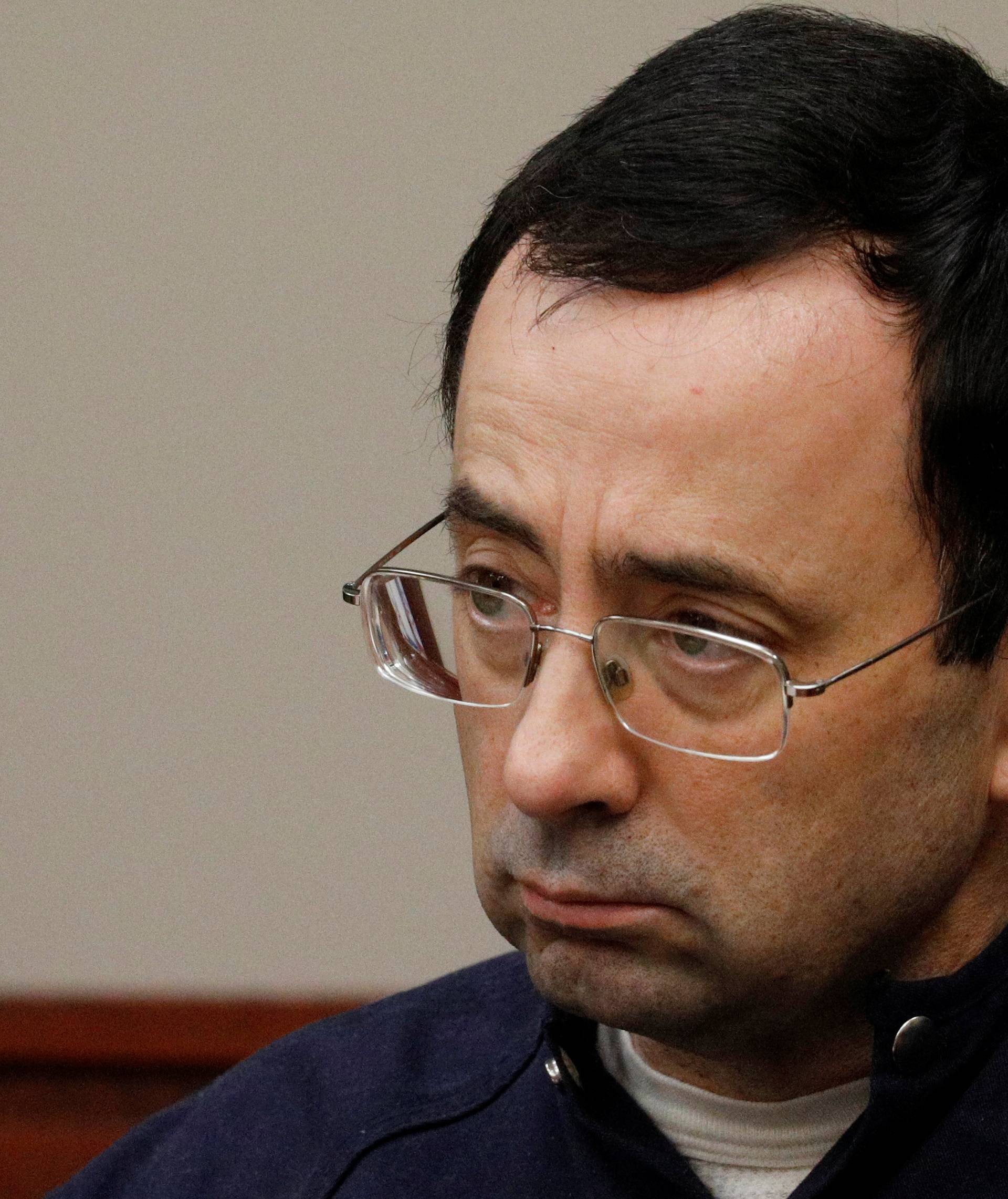 Larry Nassar, a former team USA Gymnastics doctor who pleaded guilty in November 2017 to sexual assault charges, sits in the courtroom during his sentencing hearing in Lansing, Michigan