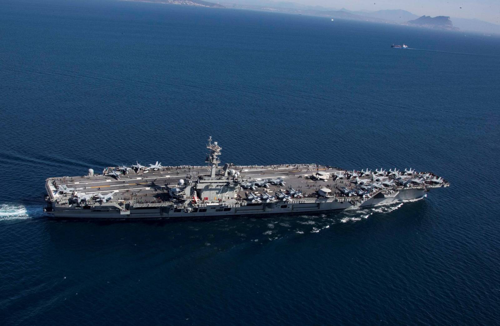 The Nimitz-class aircraft carrier USS Abraham Lincoln (CVN 72) transits the Strait of Gibraltar, entering the Mediterranean Sea