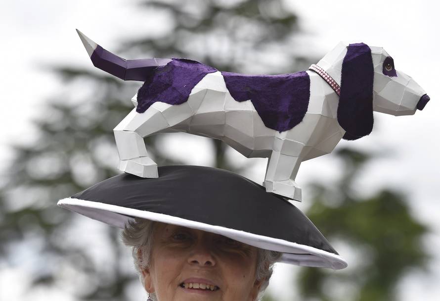 Britain Horse Racing Ladies Day Racegoer wears hat