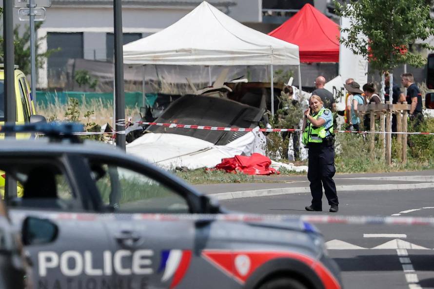 French rescuers work at the site of a plane crash, in Tomblaine