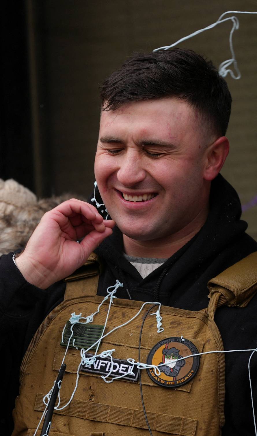 People attend the "March Against Minnesota Fraud" in Minneapolis