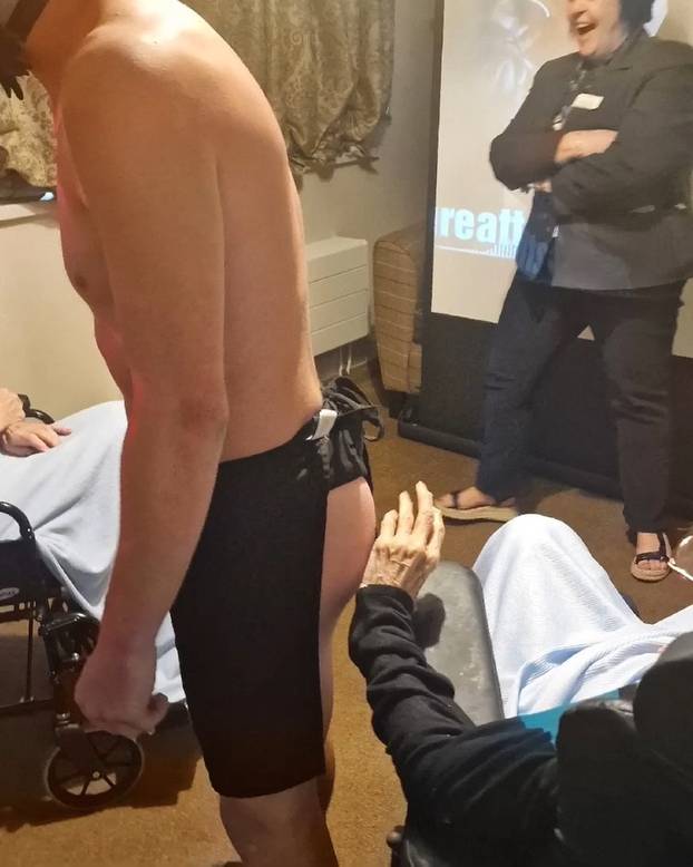 Tea and beef-cake! OAP gets Butler in the Buff for her 103rd birthday at care home