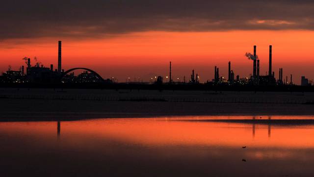 Docks are seen at sunset at the Industrial port of Marghera in the lagoon of Venice