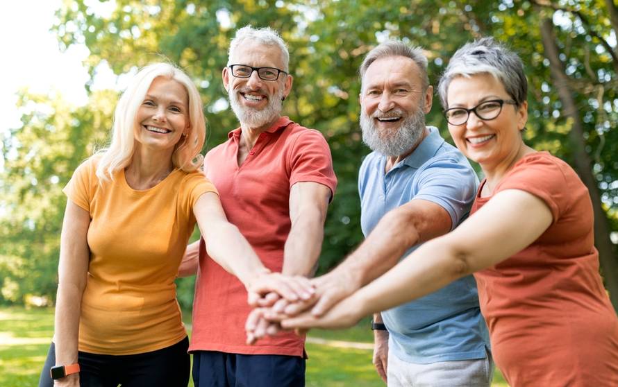Group,Of,Cheerful,Senior,People,Stacking,Hands,After,Sport,Workout