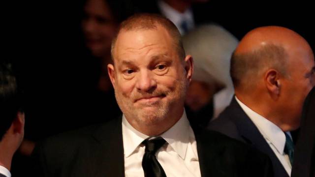 FILE PHOTO: Producer Weinstein stands in the audience ahead of the first presidential debate between U.S. presidential nominee Donald trump and U.S. presidential nominee Clinton in Hempstead