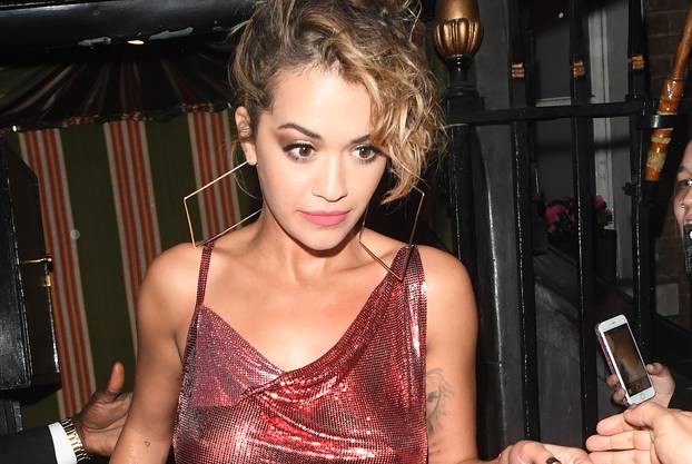 Rita Ora seen leaving Annabells nightclub in London after performing her secret gig. Rita was seen being helped to her car by security as she looked a little blurry eyed.