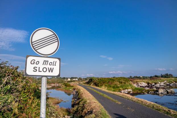Sign,Asking,For,Driving,Slow,In,Irish,:,Go,Mall