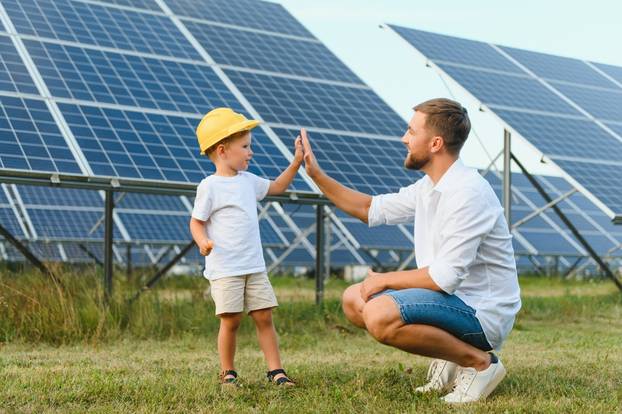 Happy,Father,And,His,Little,Son,Are,Walking,Near,The