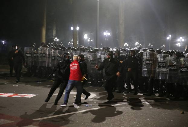 Opposition supporters hold a rally on the day of local elections in Tbilisi