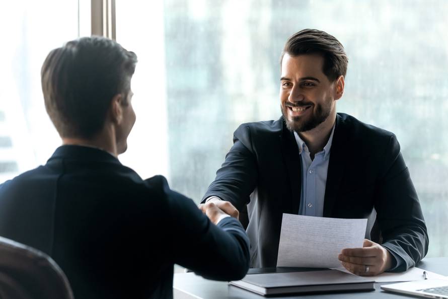 Smiling,Bearded,Businessman,In,Suit,Shaking,Hands,With,Job,Seeker.