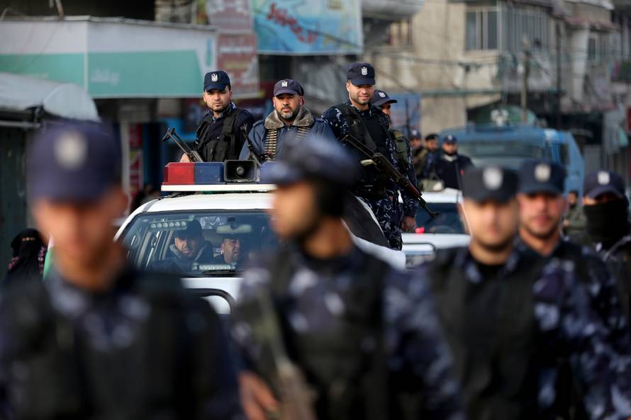 Palestinian policemen loyal to Hamas participate in a march as they protest against the U.S. Middle East peace plan, in Khan Younis in the southern Gaza Strip