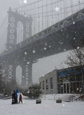 A family visits at Brooklyn Bridge Park