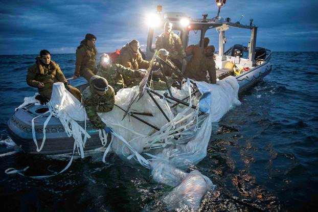 FILE PHOTO: Sailors recover a high-altitude surveillance balloon off the coast of Myrtle Beach, South Carolina