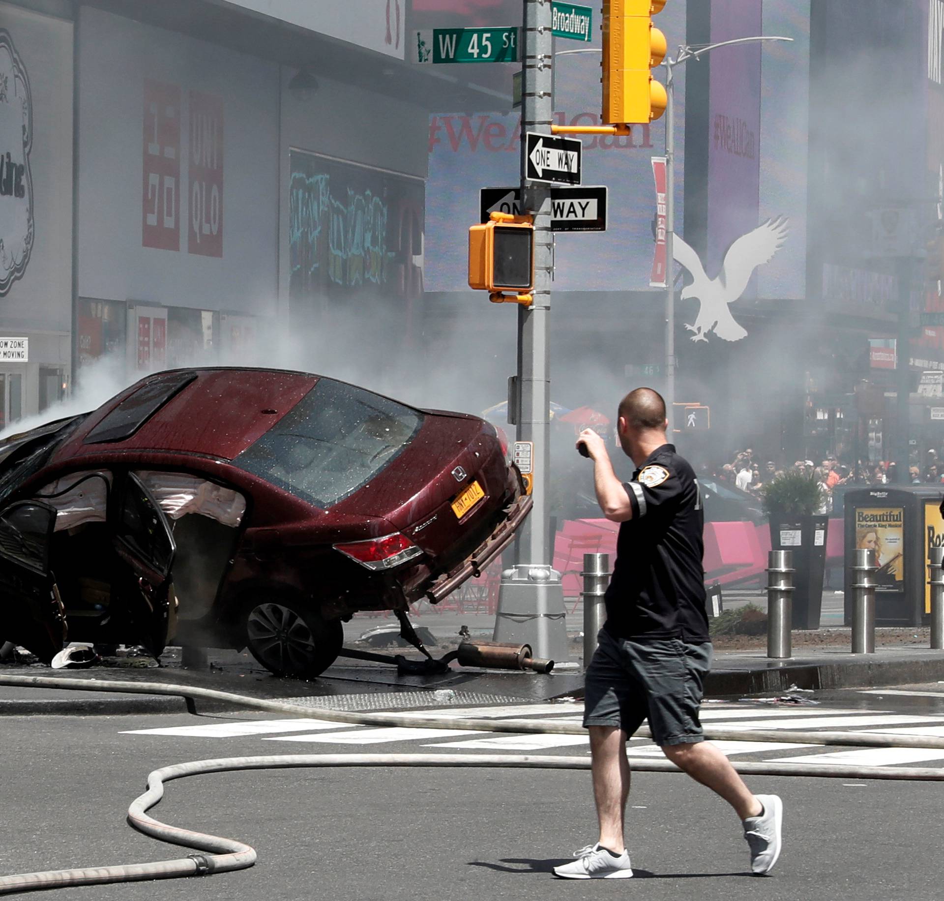 A vehicle that struck pedestrians and later crashed is seen on the sidewalk in Times Square in New York City