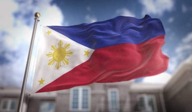 Philippines Flag 3D Rendering on Blue Sky Building Background 