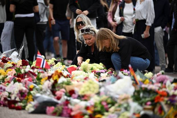 Mourners gather outside the Royal Palace, following the death of Norway's King Harald, in Oslo
