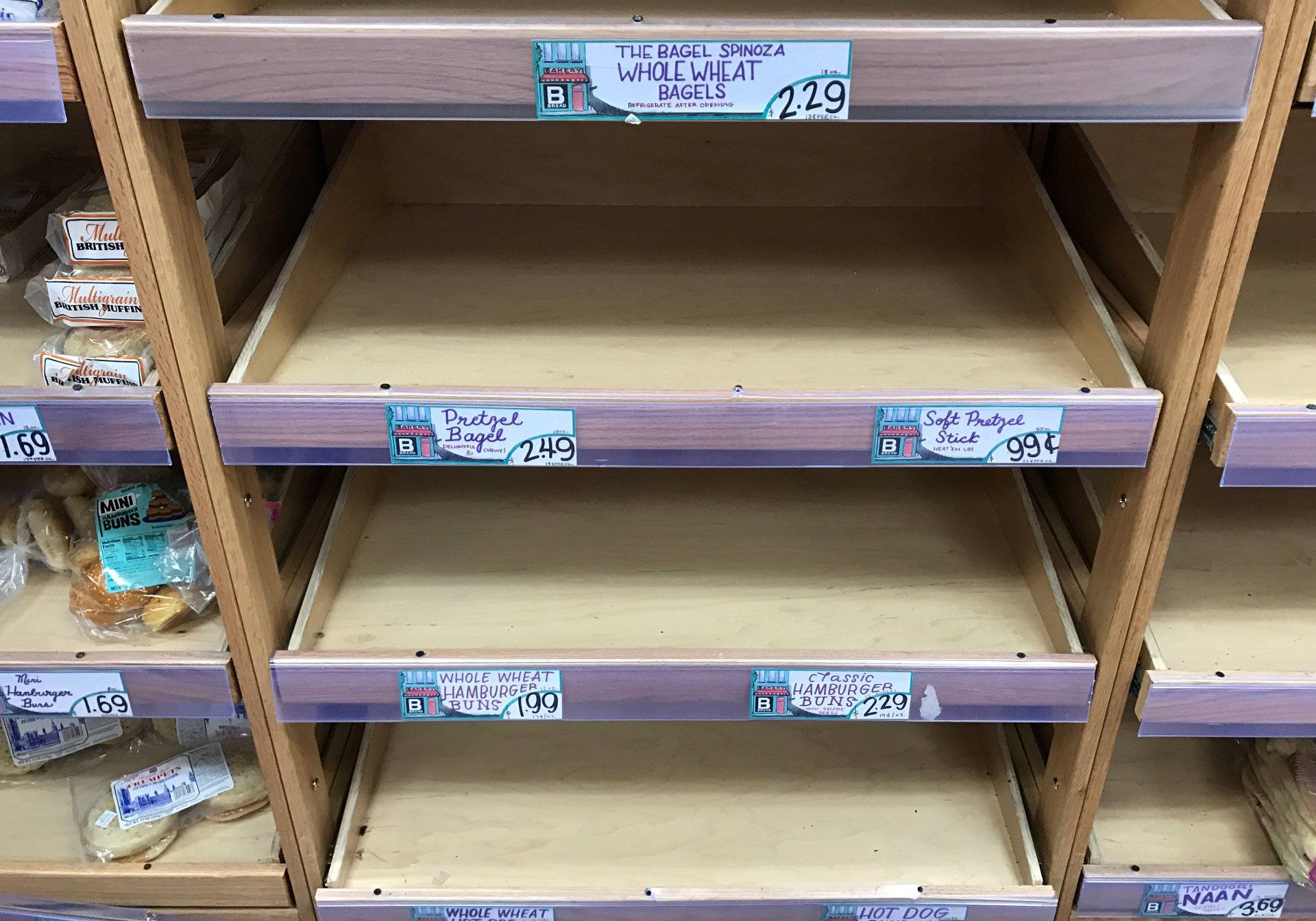 Shelves are seen scarce with bread at a Trader Joe's grocery store ahead of a fast-moving winter storm expected to hit the northeastern United States, in the borough of Manhattan in New York