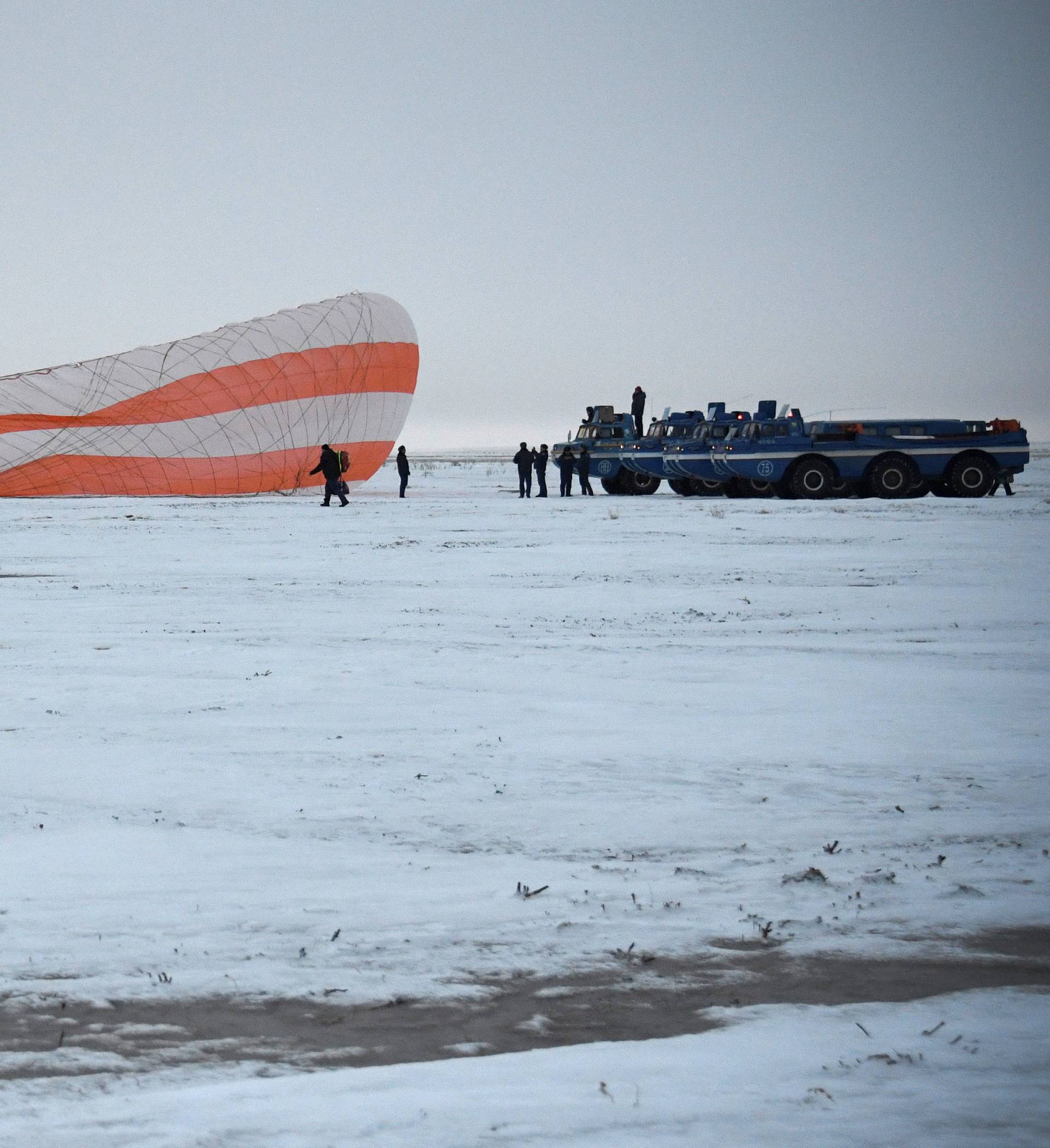 Search and rescue team works on the site of landing of the Soyuz MS-06 space capsule with International Space Station crew members Acaba and Vande Hei of the U.S., and Misurkin of Russia in a remote area outside the town of Dzhezkazgan
