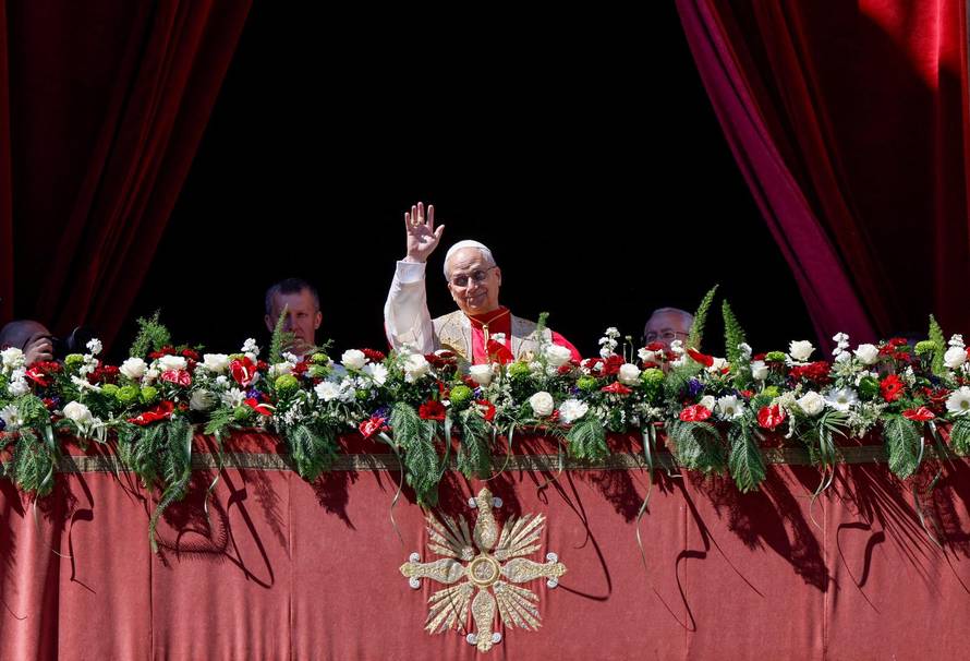 Pope Leo XIV delivers his "Urbi et Orbi" (To the city and the world) message from the main balcony of St. Peter's Basilica
