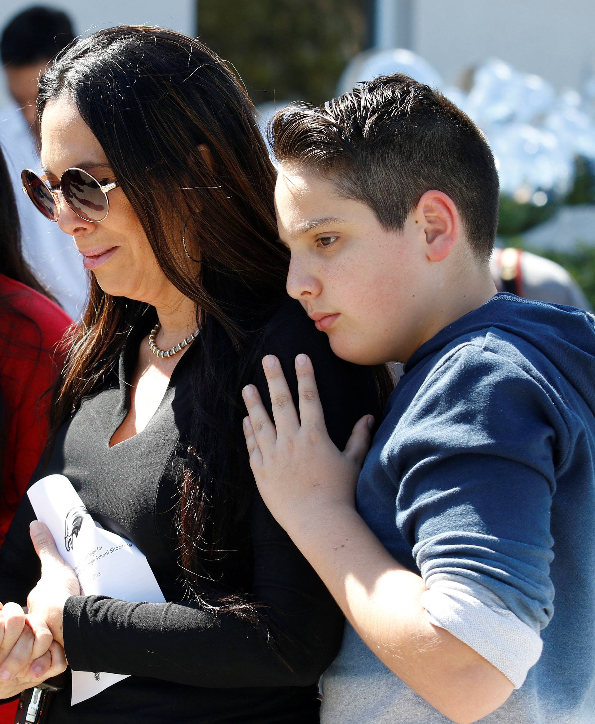 Students and parents from Marjory Stoneman Douglas High School attend a memorial following a school shooting incident in Parkland