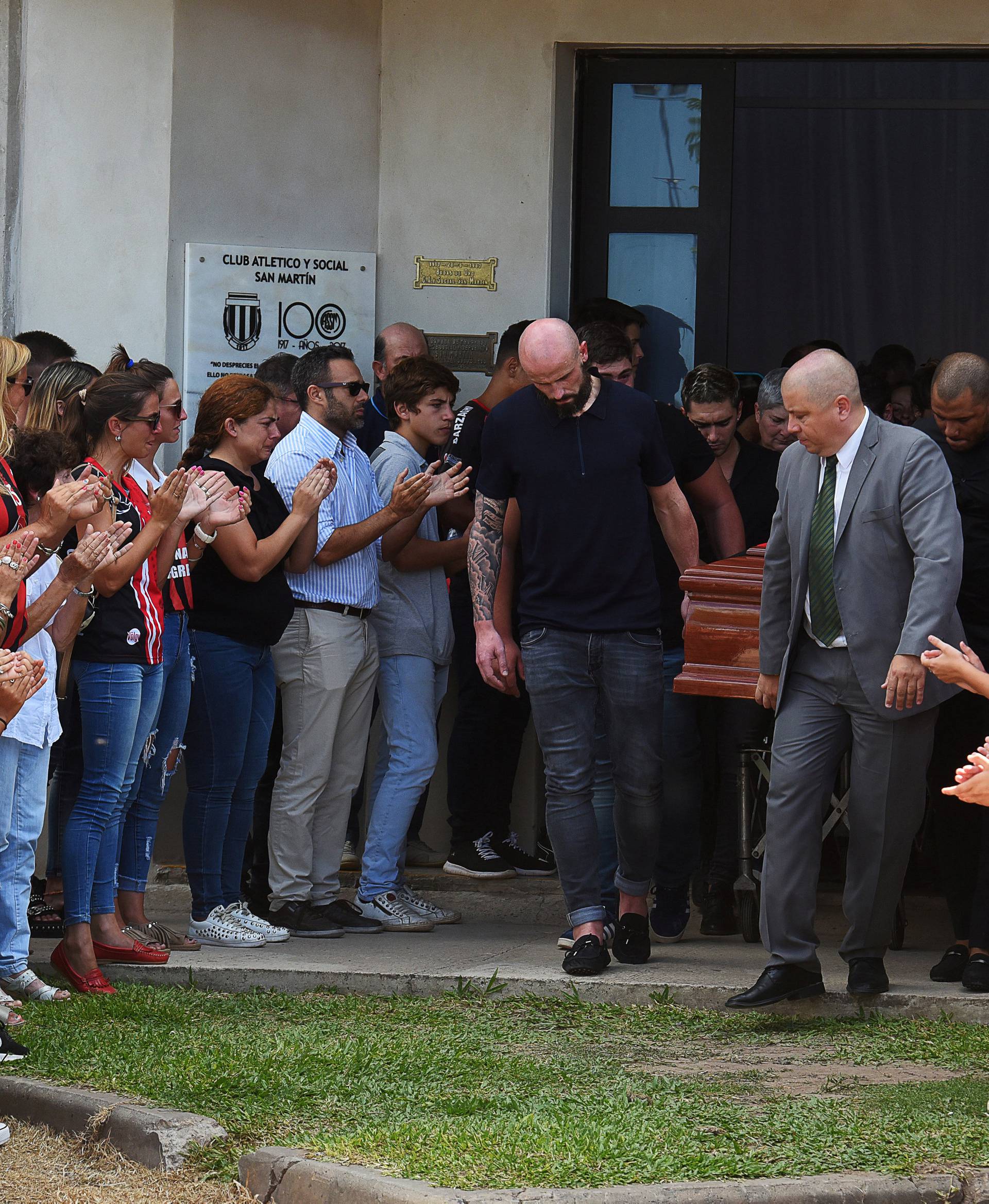 Family and friends carry the coffin of Emiliano Sala, soccer player who died in a plane crash in the English Channel, while a crowd attends his wake in Progreso