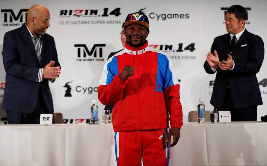 Undefeated boxer Floyd Mayweather Jr. of the U.S. attends a news conference inn Tokyo