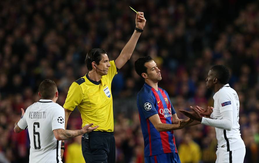 Paris Saint-Germain's Blaise Matuidi is shown a yellow card by referee Deniz Aytekin