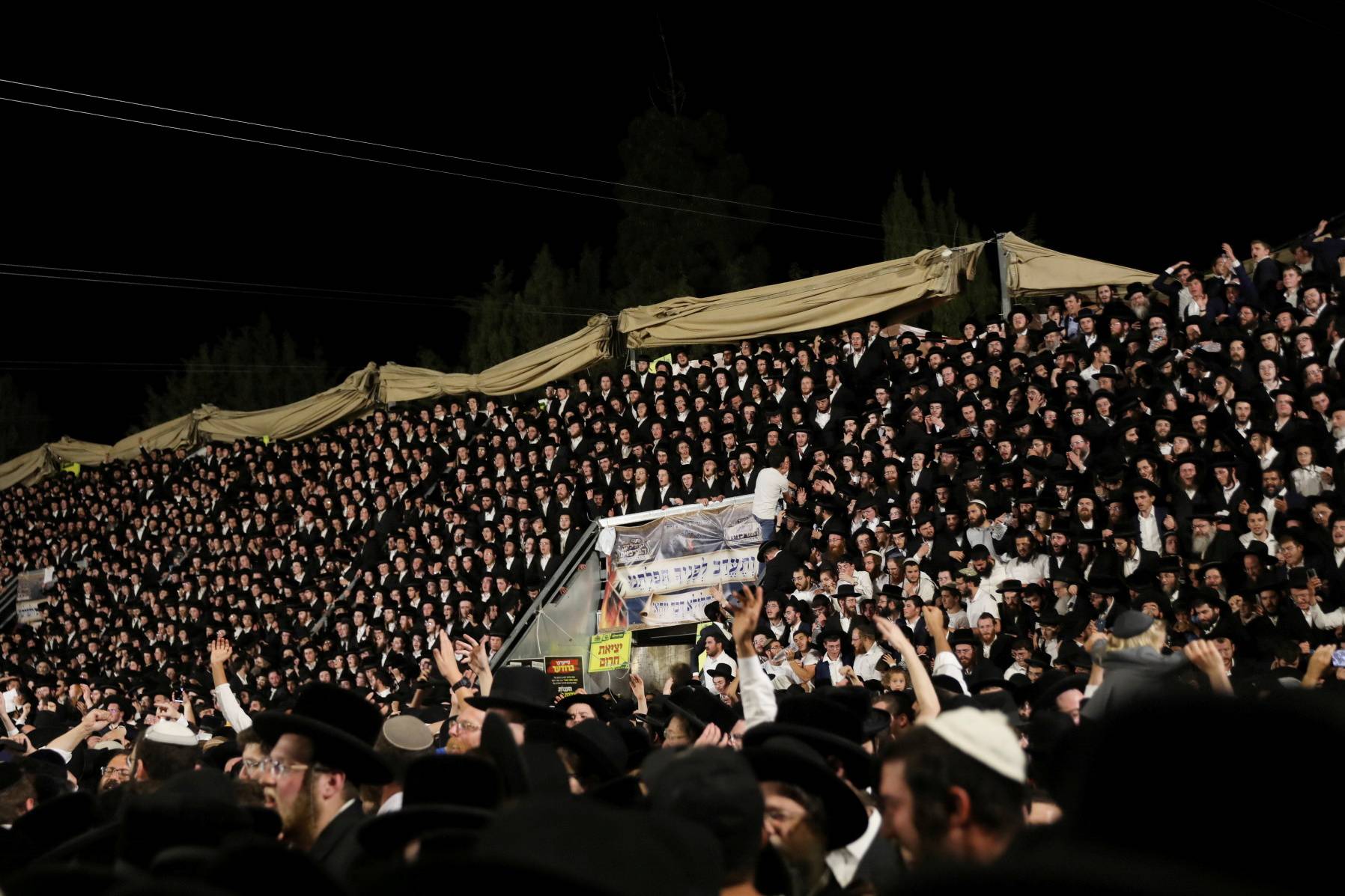 Jewish worshippers sing and dance at the Lag B'Omer event in Mount Meron, northern Israel