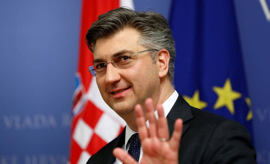 Croatia's Prime Minister Andrej Plenkovic gestures in a government building in Zagreb