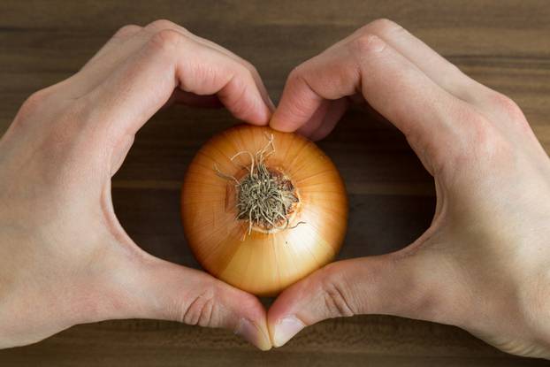 Onion,Is,Good,For,The,Woman,On,The,Wooden,Background.