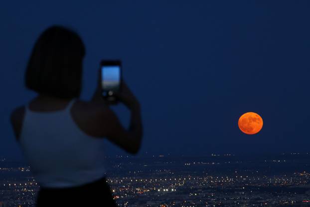 A super moon, known as the Blue Moon, rises over Ciudad Juarez