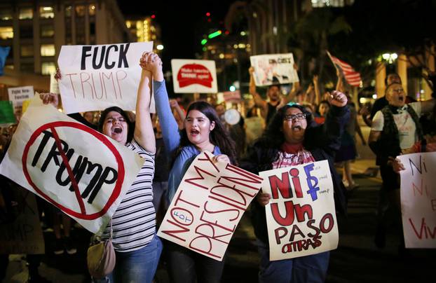 Demonstrators walk through Downtown San Diego in protest to the election of Republican Donald Trump as the president of the United States in San Diego