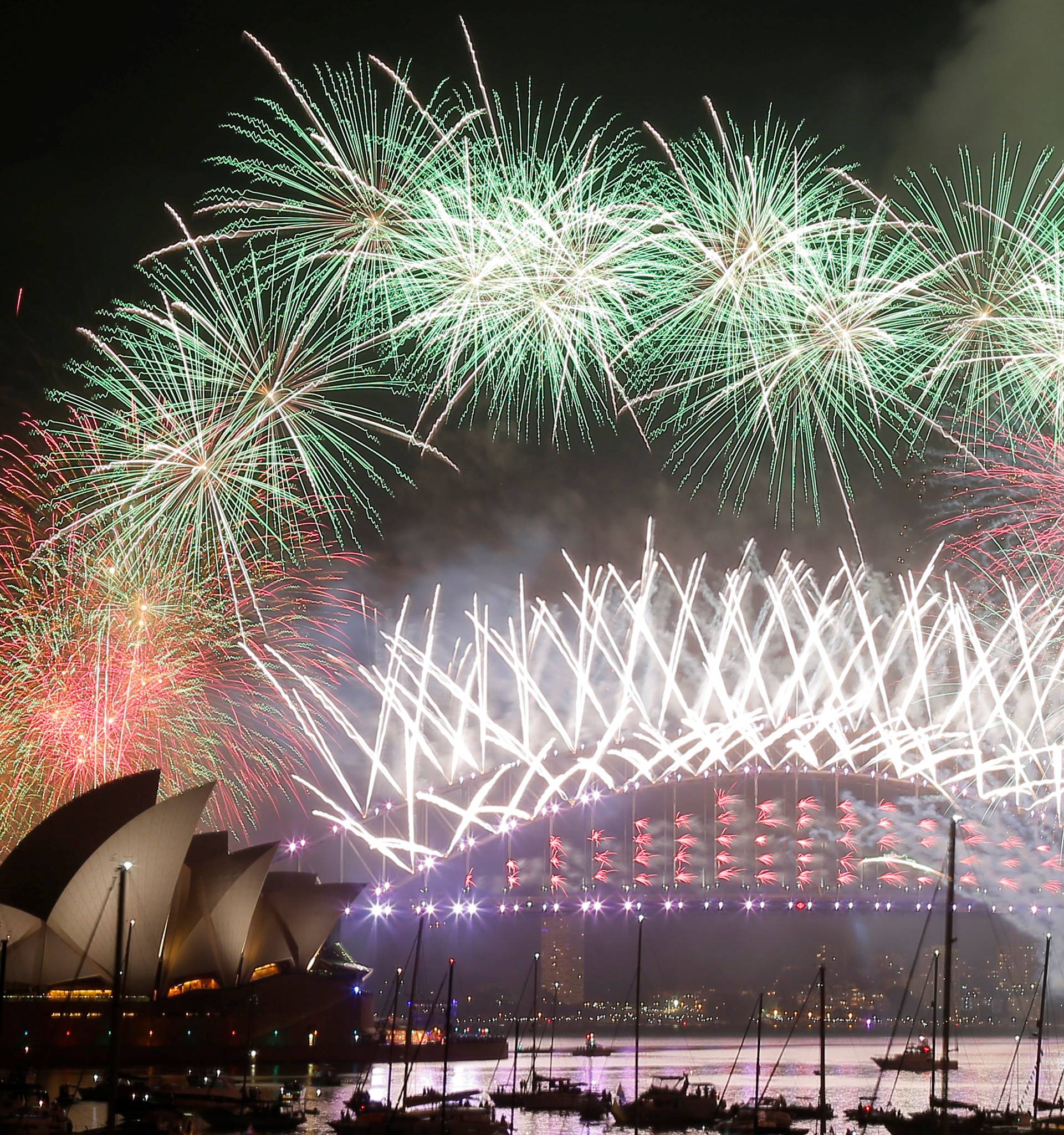 Fireworks explode over the Sydney Opera House and Harbour Bridge as Australia ushers in the New Year in Sydney