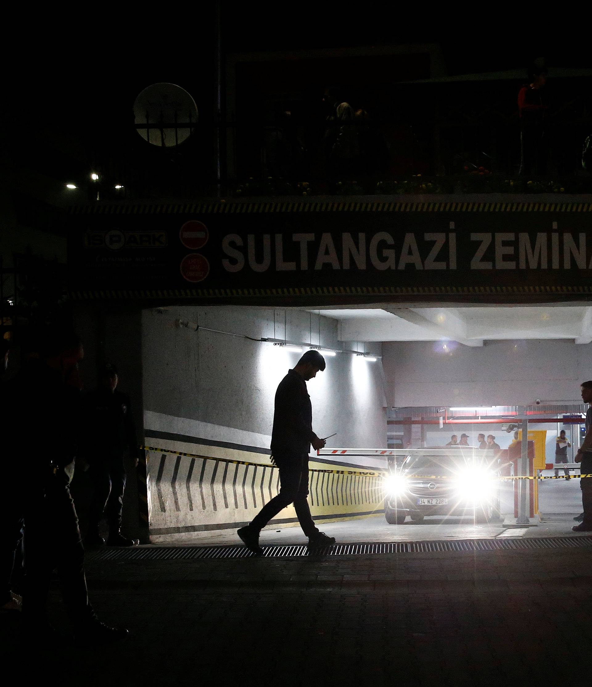 Turkish police officers stand guard outside a car park where a vehicle belonging to Saudi Arabia's consulate was found, in Istanbul