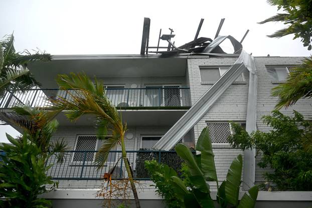 Damaged roof of holiday apartments is pictured at Labrador after heavy rains and winds caused by Cyclone Alfred, on the Gold Coast