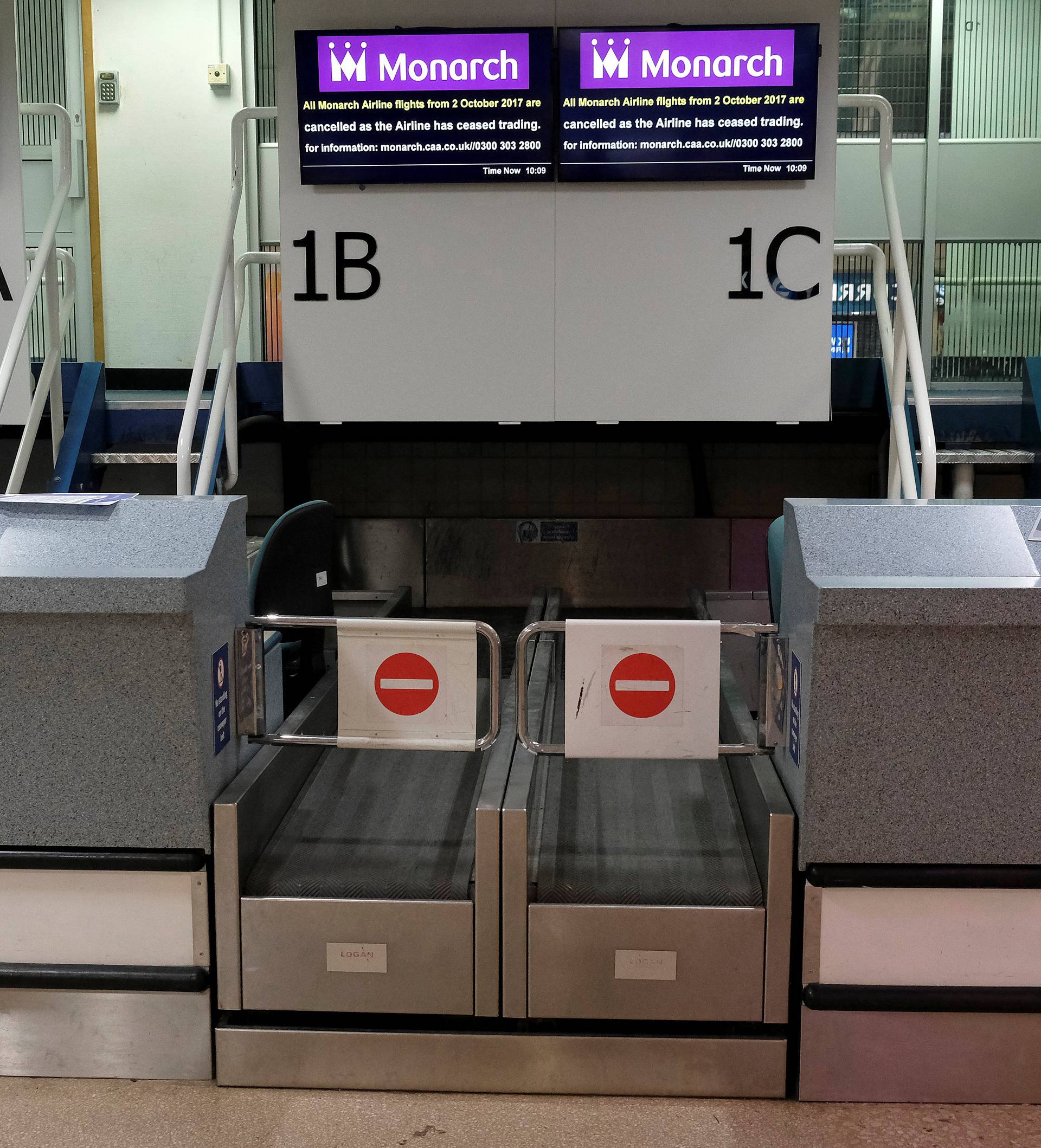 Monarch Airlines check-in desks stand empty after the airline ceased trading at Birmingham Airport