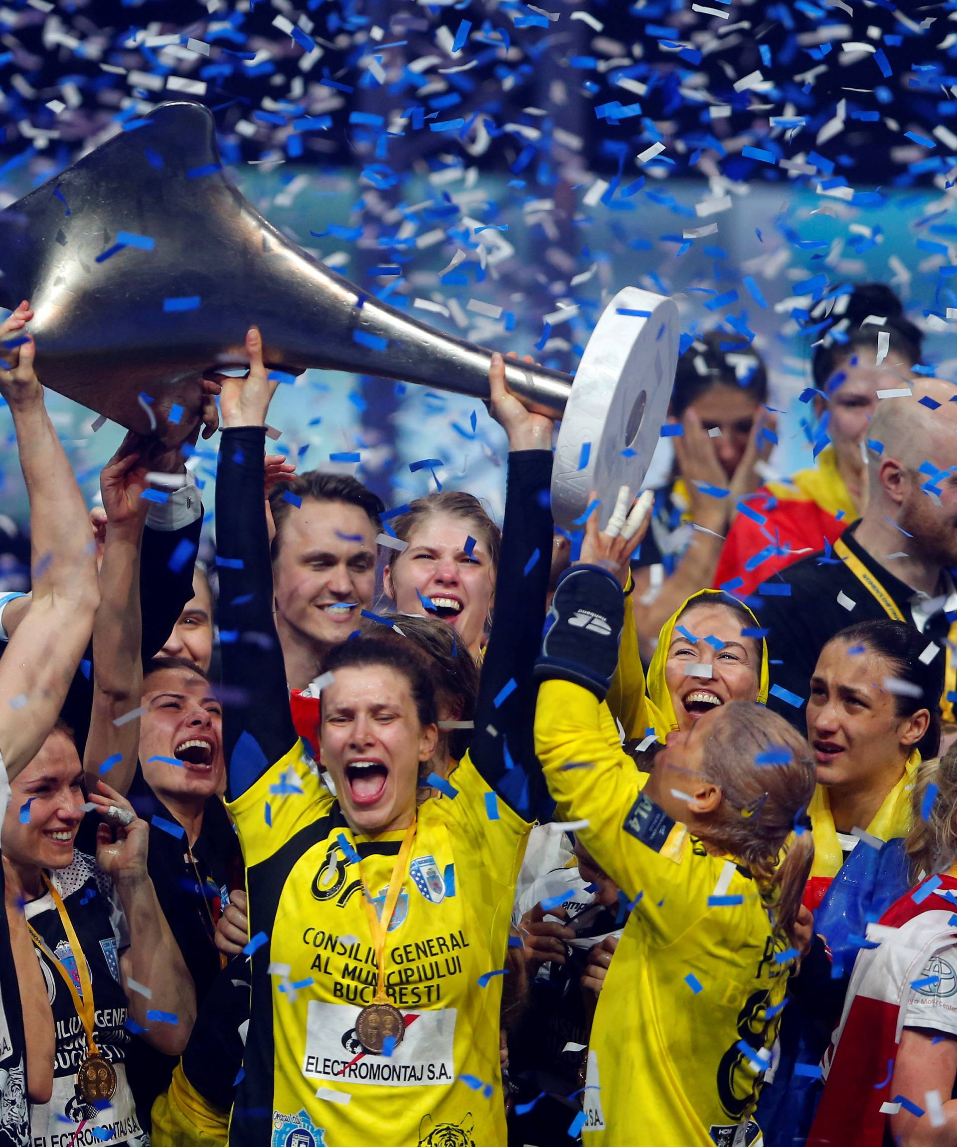 Players of the CSM Bucuresti celebrate with the trophy after they won the EHF Women's Champions League Final 4 handball in Budapest