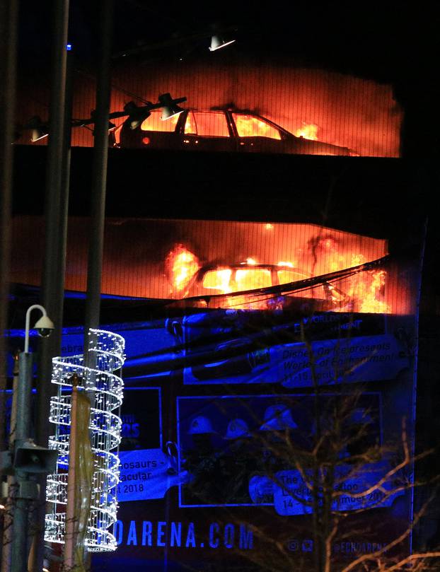 Cars are seen on fire during a serious blaze in a multi-storey car park in Liverpool, Britain.