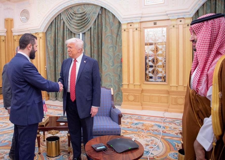 FILE PHOTO: U.S. President Donald Trump meets with Syrian President Ahmed al-Sharaa in Riyadh