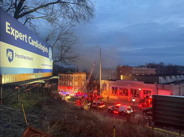 A general view shows smoke coming out from a chocolate factory after fire broke out, in West Reading