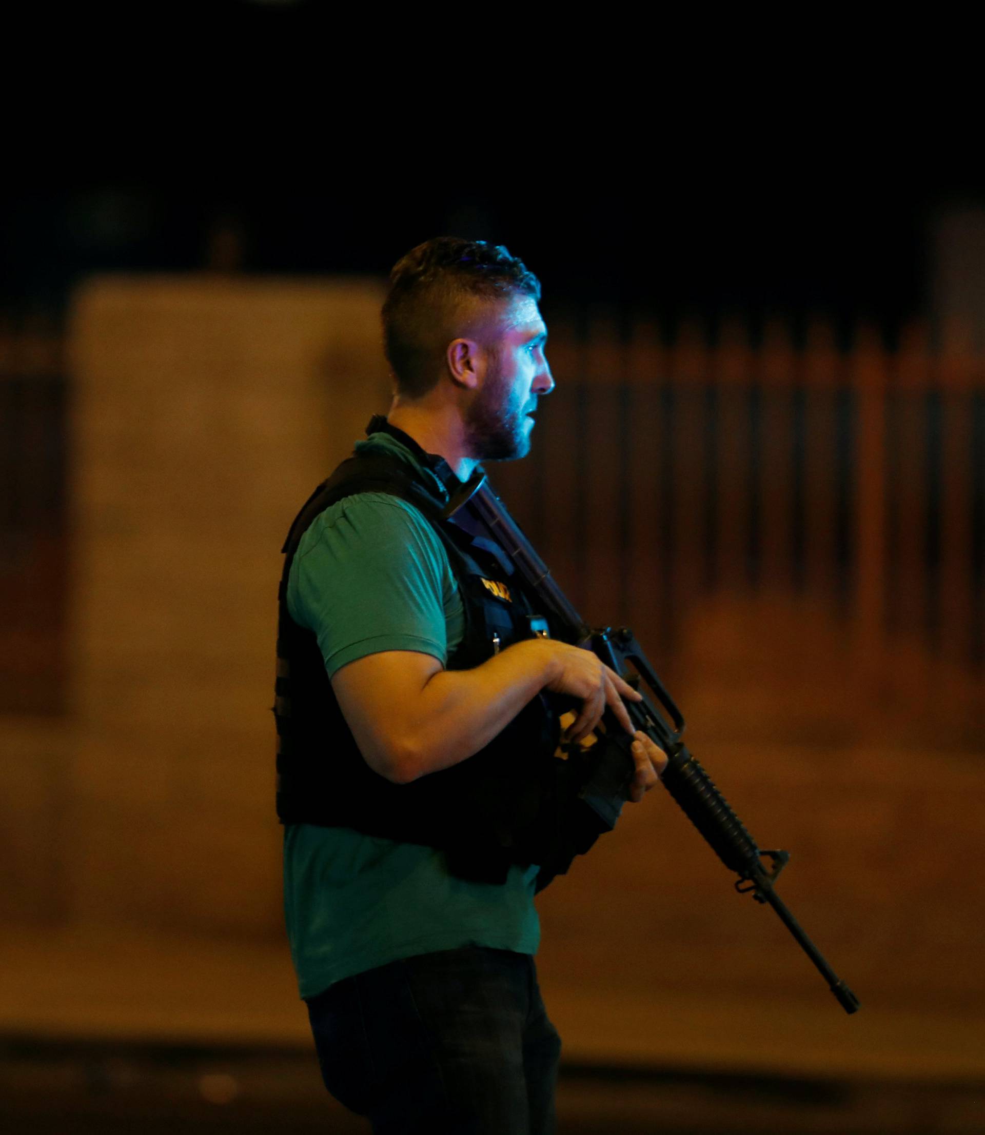 Las Vegas Metro Police officers work near the concert venue after a mass shooting at a music festival on the Las Vegas Strip in Las Vegas