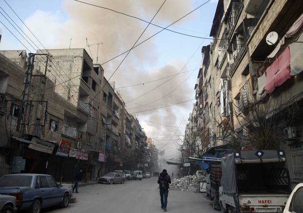 Smoke from air raid rises in the besieged town of Douma, Eastern Ghouta, Damascus