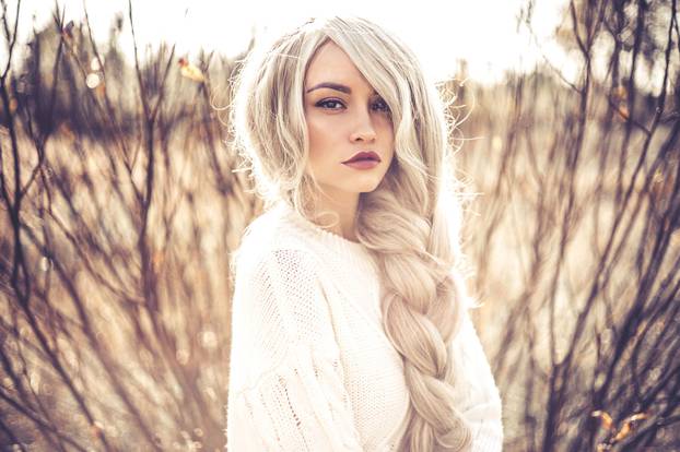 Beautiful lady in autumn landscape